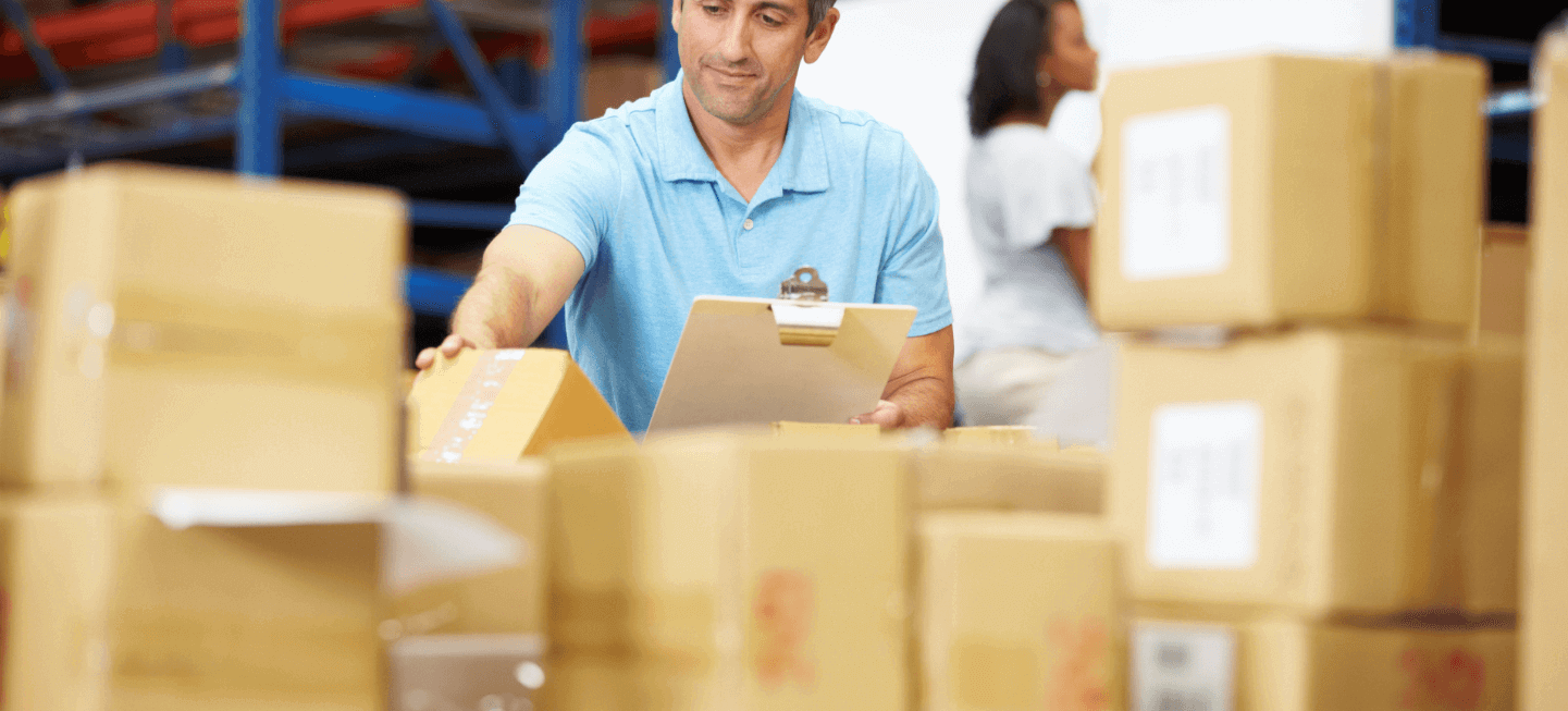 man with boxes in logistics job