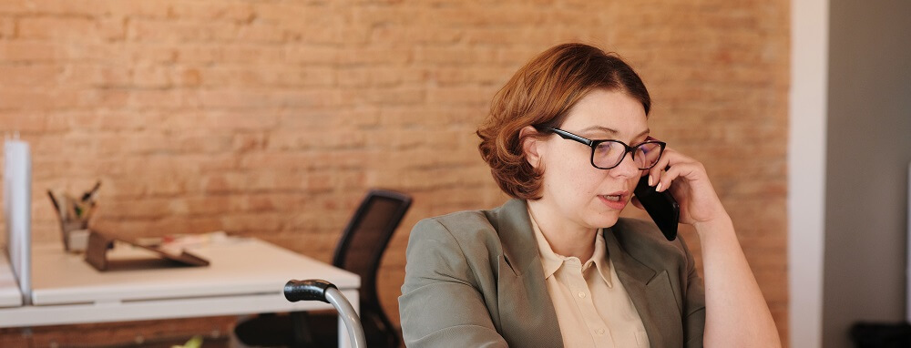 photo of woman talking on the phone