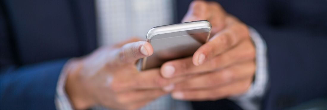 Business man with phone in hands